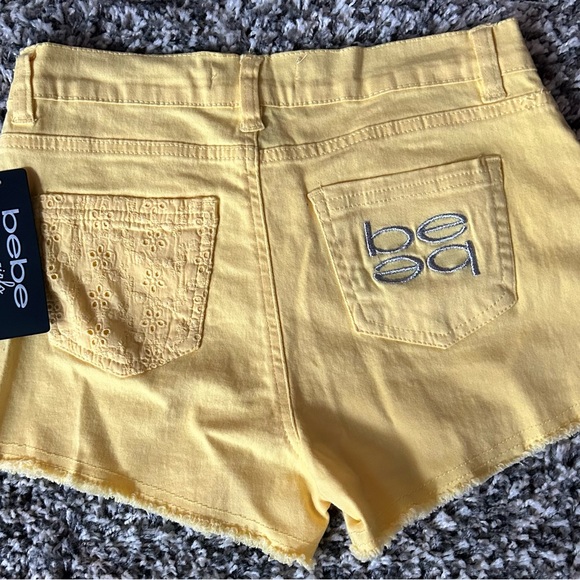 Girls shorts , size 14,(27”Waist)NWT, Bebe yellow,sits on hips.Has stretch - Picture 2 of 2